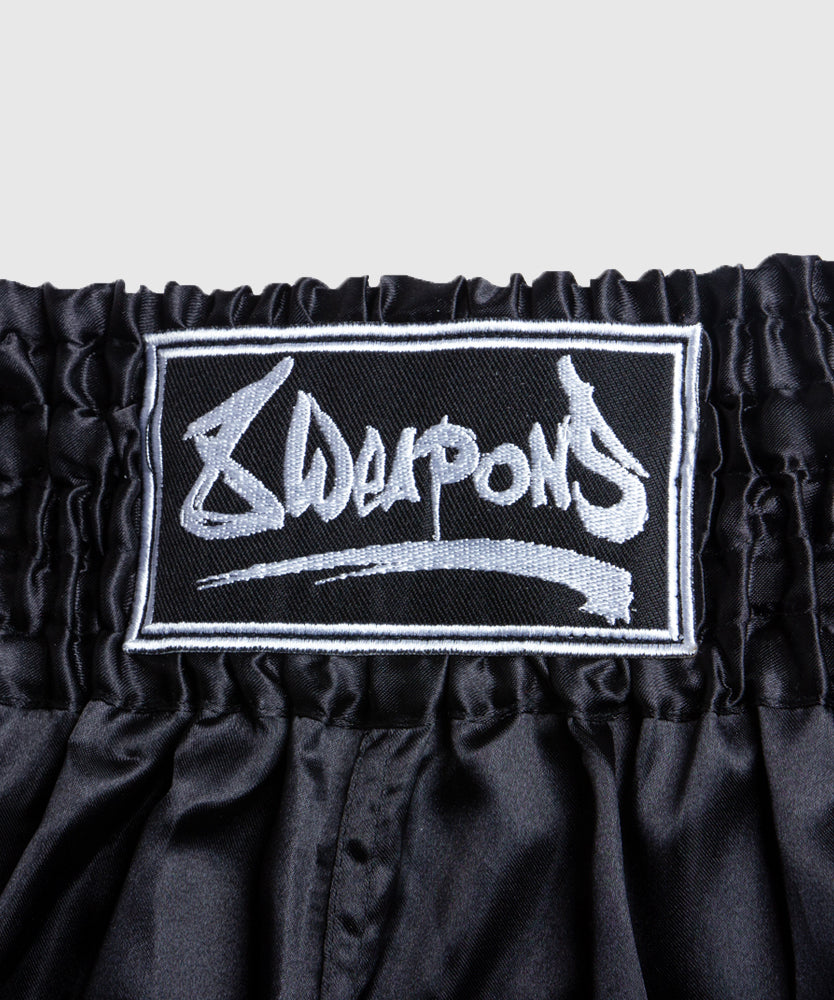 8 Weapons Strike Pantalones de Muay Thai - Negro/Plata