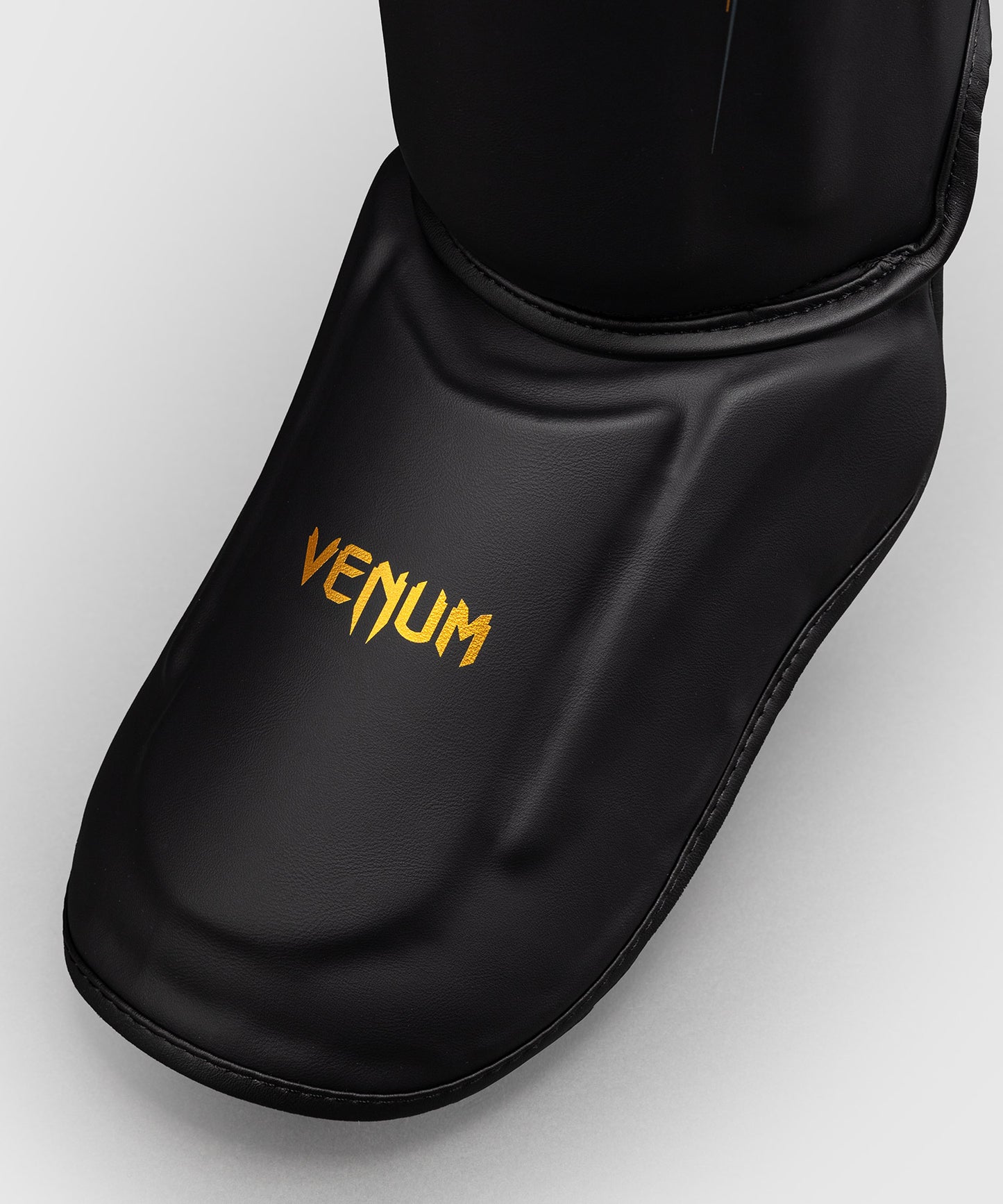 Protège-tibias Venum Streamline – Noir/Or