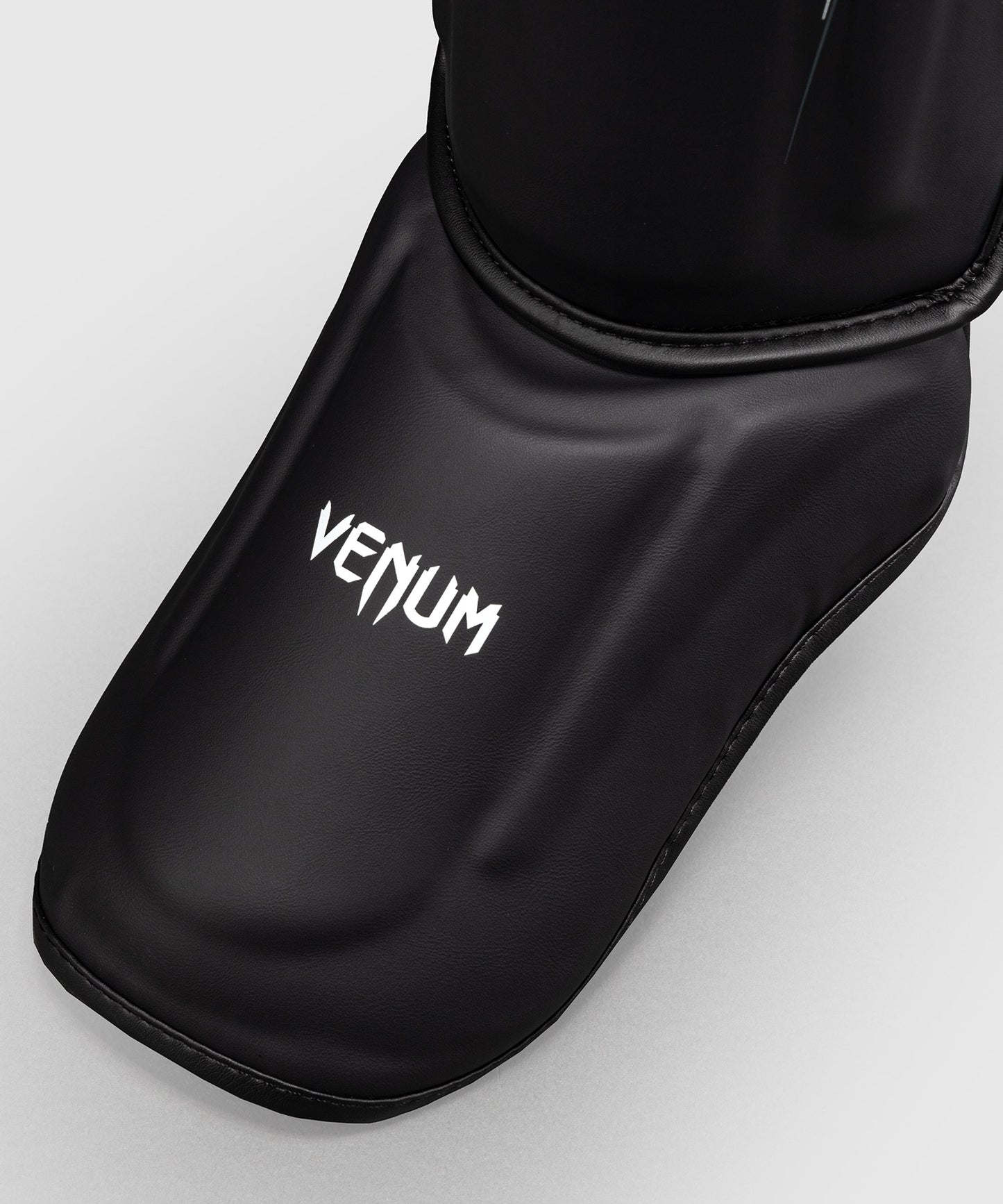 Venum Streamline Paratibie – Nero/Bianco