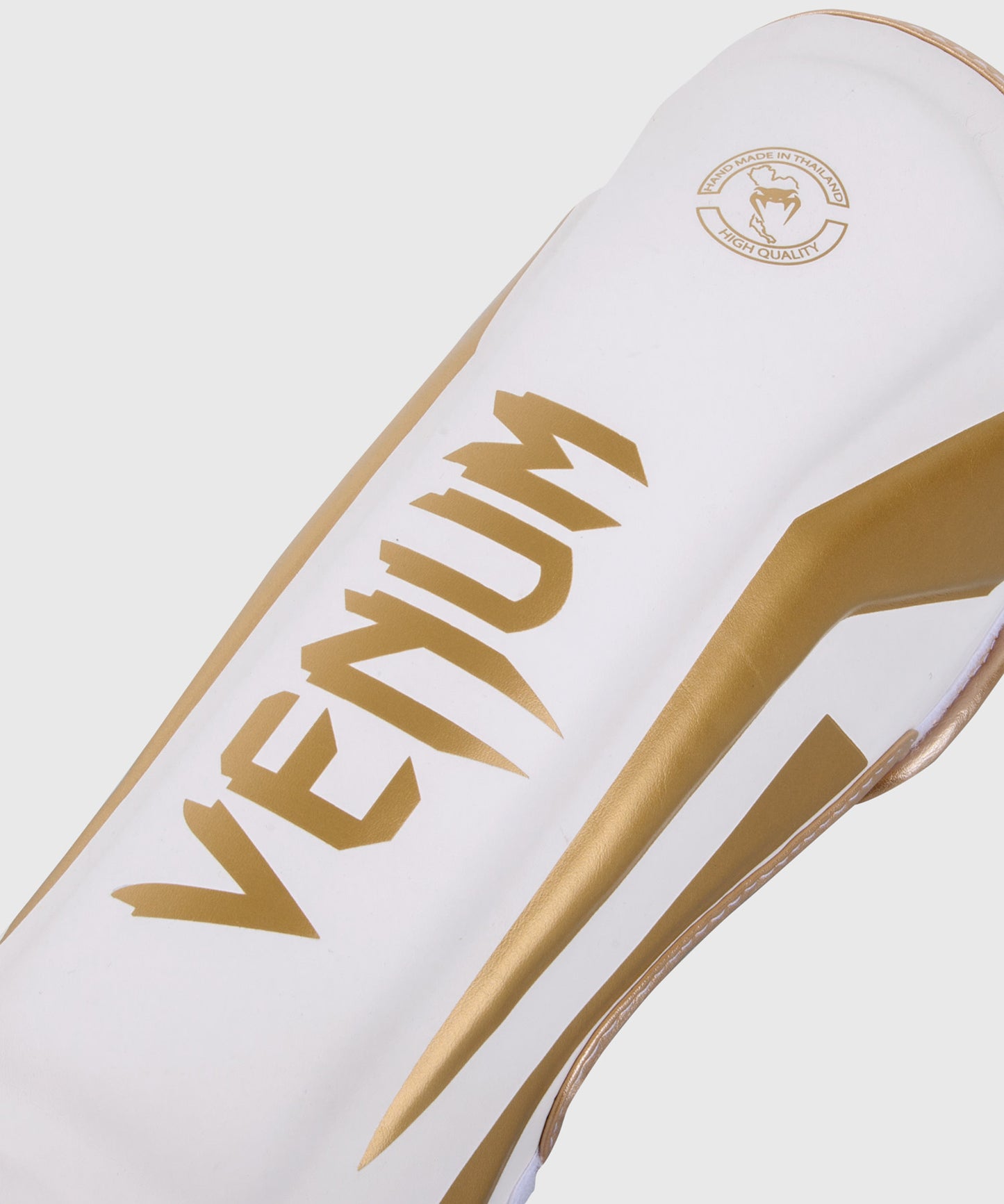 Espinilleras Venum Elite Standup - Blanco/Oro