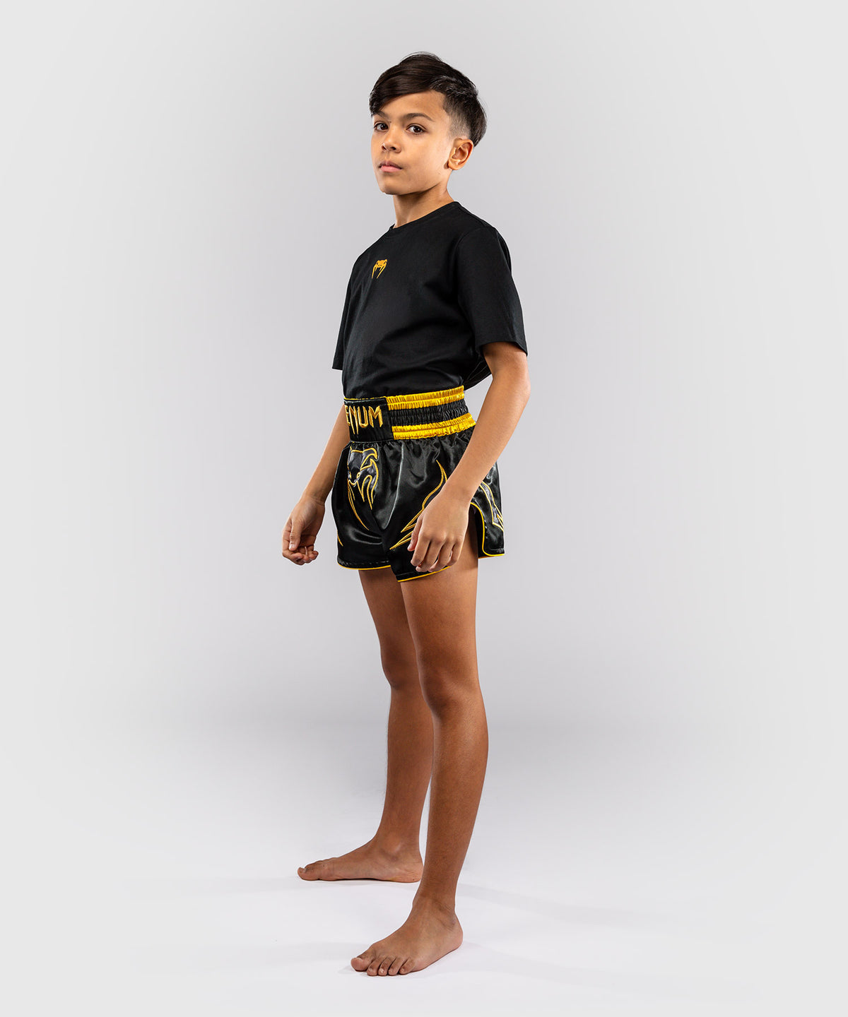 Venum Bangkok Fury Pantalón corto de Muay Thai para niños - Negro/Dorado