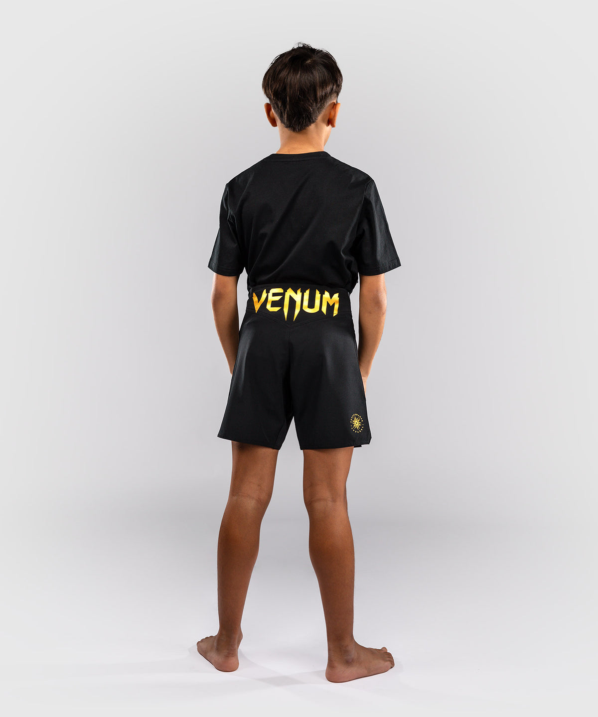 Venum Attack Fightshorts para niños - Negro/Dorado