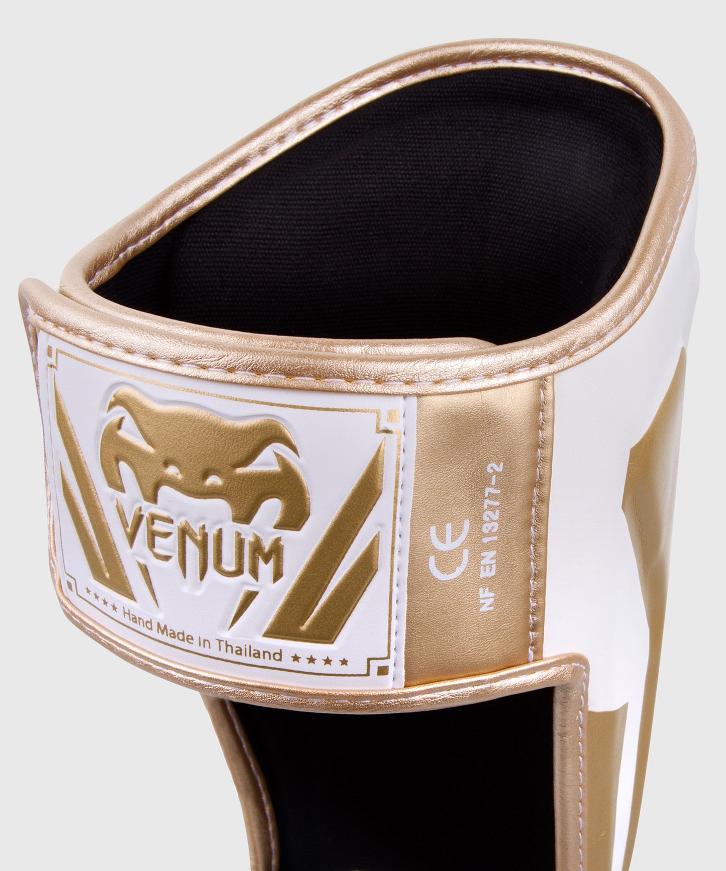 Espinilleras Venum Elite Standup - Blanco/Oro