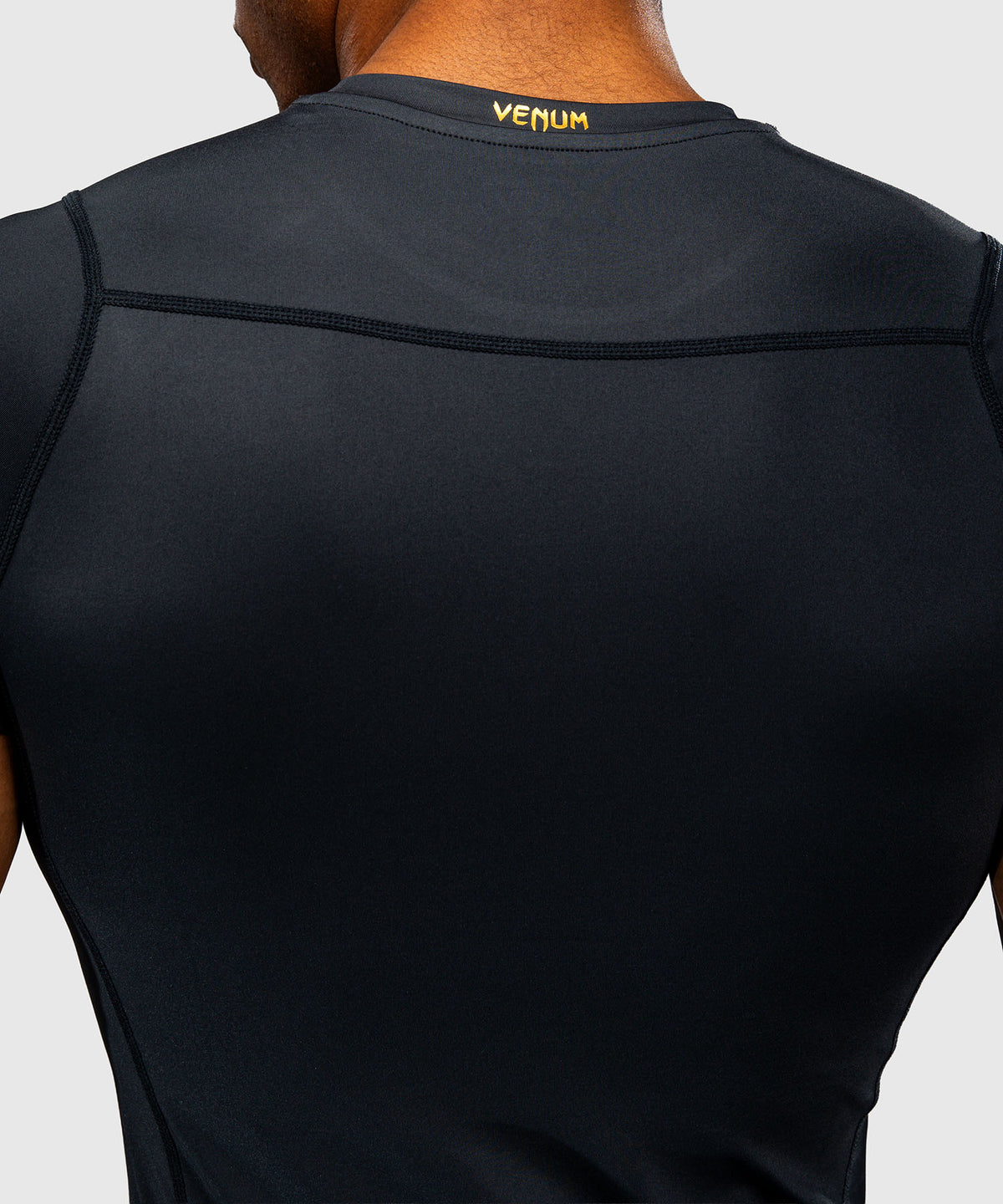 Venum Attack Kurzarm-Rashguard - Schwarz/Gold