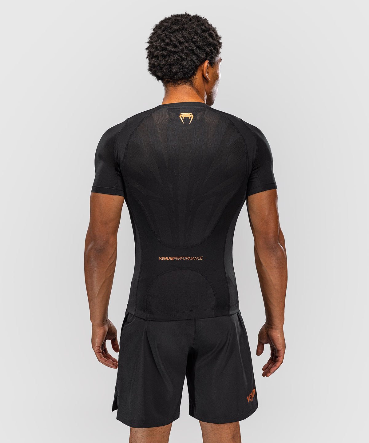 Venum G-Fit Revolution Rashguard de manga corta - Negro/Cobre